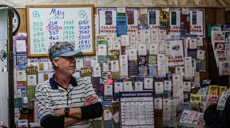 Vinny's Bar & Grill, Carry-out, Lottery owner, Vinny Nyhan in Moraine has seen an increase in lottery sales this year, which led to the Ohio Lottery providing a bonus payment last month. Nyhan described his business as one of the top 10 lottery sellers in the Dayton area. JIM NOELKER/STAFF