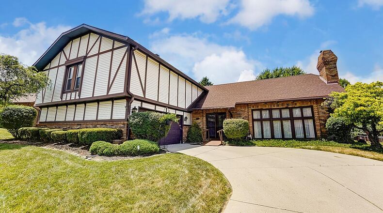 This Springfield two story has four bedrooms, including a main floor primary suite and has been updated with a newer kitchen and flooring.