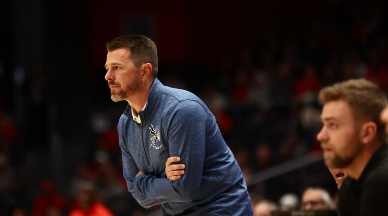 Cedarville's Pat Estepp coaches during a exhibition game against Dayton on Saturday, Oct. 28, 2023, at UD Arena. David Jablonski/Staff