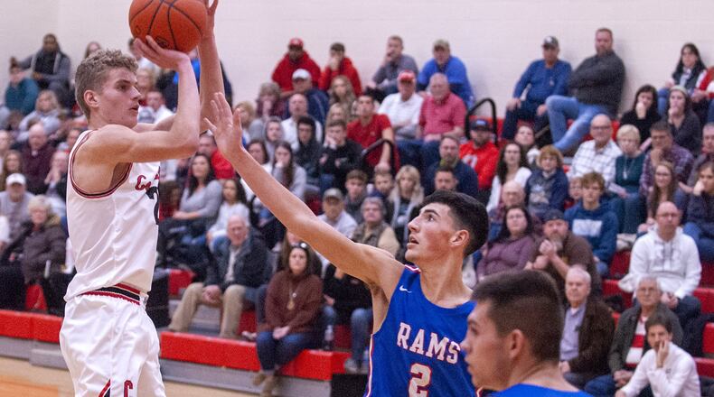 Cedarville’s Trent Koning shoots over Greeneview’s Cole Allen during Friday night’s OHC game in Cedarville. Koning scored 16 points to lead the Indians to a 48-43 victory. Jeff Gilbert/CONTRIBUTED