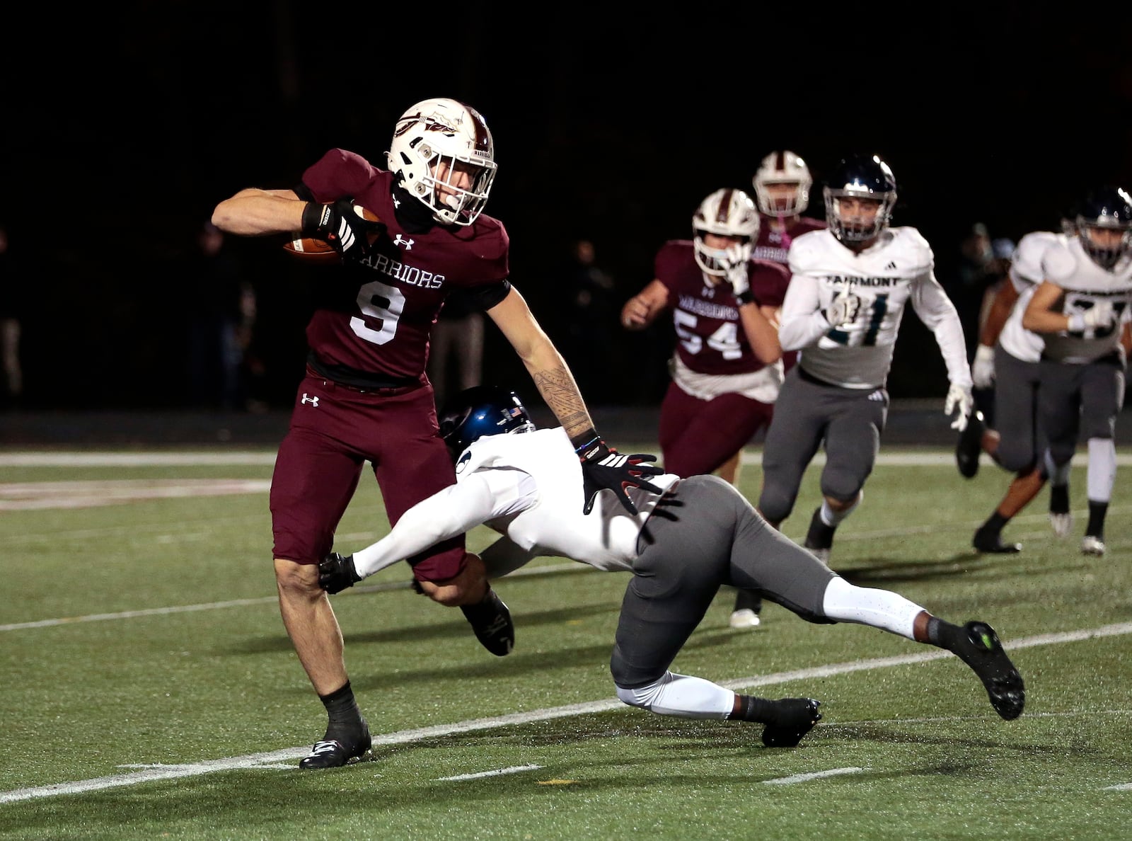 Lebanon senior Nick Lautar eludes a tackle attempt by a Fairmont defender. Lebanon won 22-21, Fri. Oct. 31, 2025, at James VanDeGrift Stadium in Lebanon. STEVEN WRIGHT / STAFF