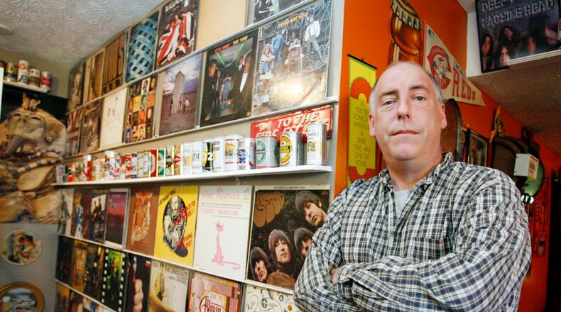 Jeff Miller of Springfield poses in the basement of his home which is decorated with record albums. Miller recalls the events of Dec. 3, 1979, when eleven people were trampled to death at a The Who concert in Cincinnati, a concert which he attended.
