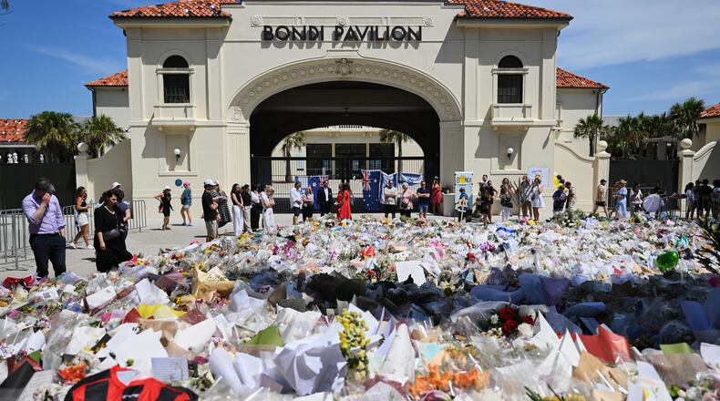Floral tributes outside Bondi Pavilion at Bondi Beach in Sydney, Thursday, Dec. 18, 2025. (AP Photo/Steve Markham)
