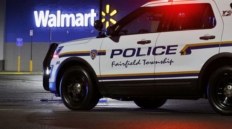 Police investigate a fatal shooting at Walmart on Princeton Road in Fairfield Township Thursday, May 26, 2022. NICK GRAHAM/STAFF