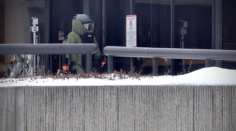 A member of the Dayton bomb squad is seen with a robot outside the public safety building in downtown Springfield Monday, Feb. 9, 2026. Contributed photo Buck Creek Photography