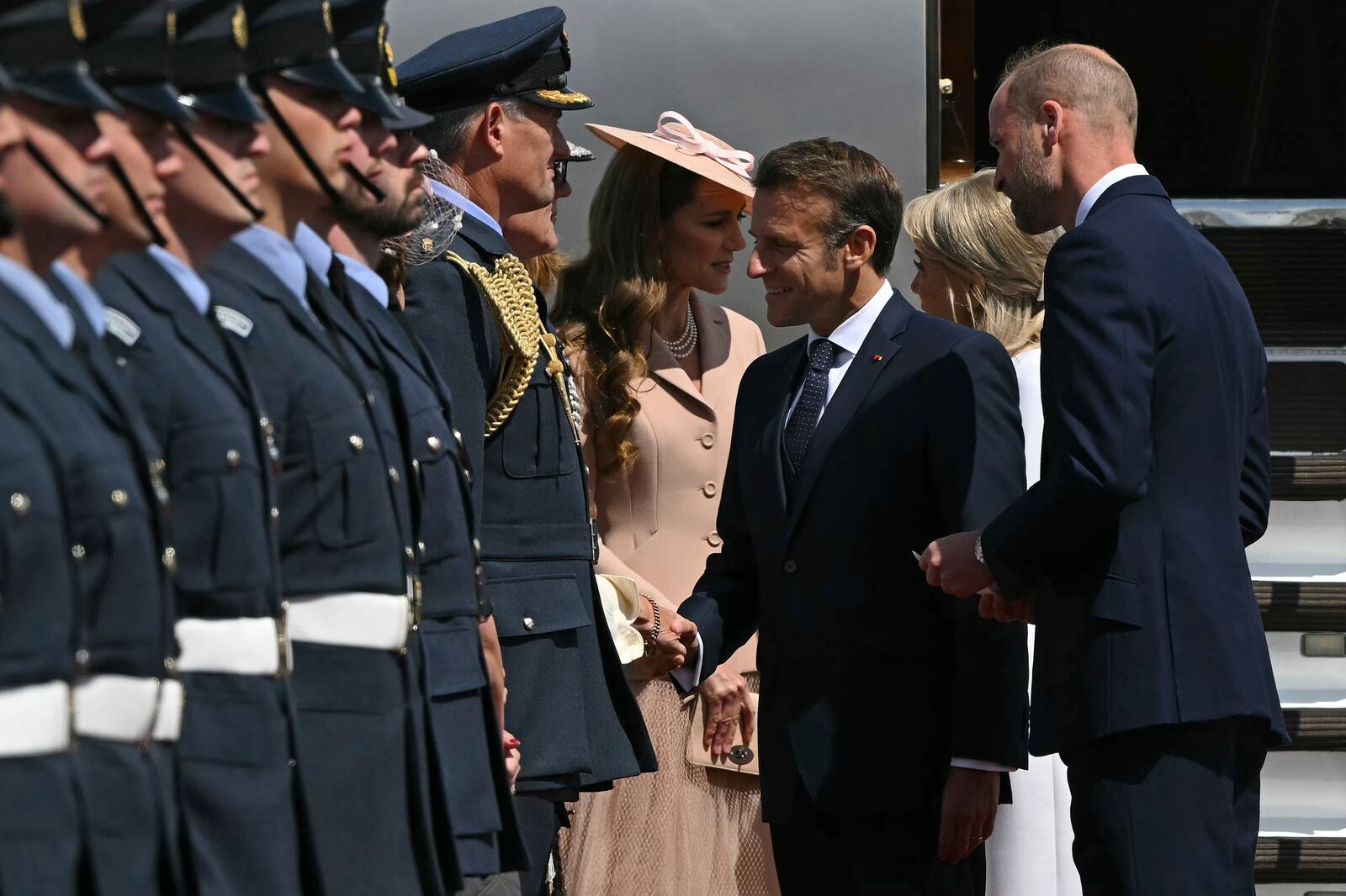 France's President Emmanuel Macron and his wife Brigitte Macron, second right, are greeted by Britain's Prince William, right, and Kate, Princess of Wales at RAF Northolt, west of London, Tuesday July 8, 2025, on the first day of a three-day state visit to Britain. (Justin Tallis/Pool via AP)