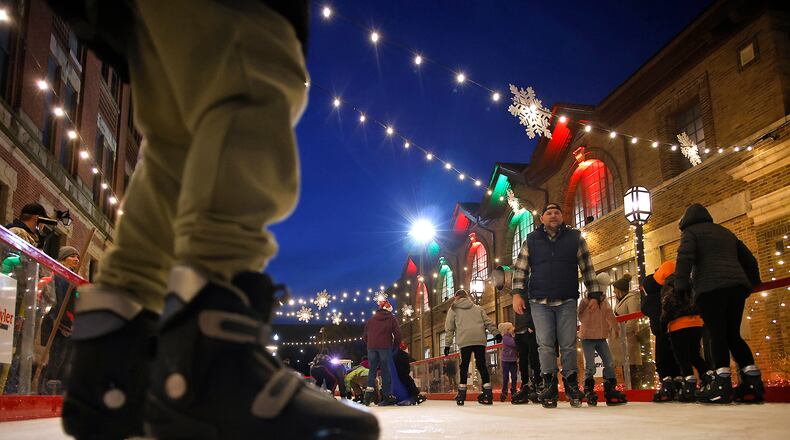 The city's outdoor ice skating rink opened for Springfield's Holiday in the City Grand Illumination Friday, Nov. 24, 2023. The annual lighting the city's Christmas tree and turning on of the holiday lights throughout downtown starts a month of activities in the downtown area. BILL LACKEY/STAFF