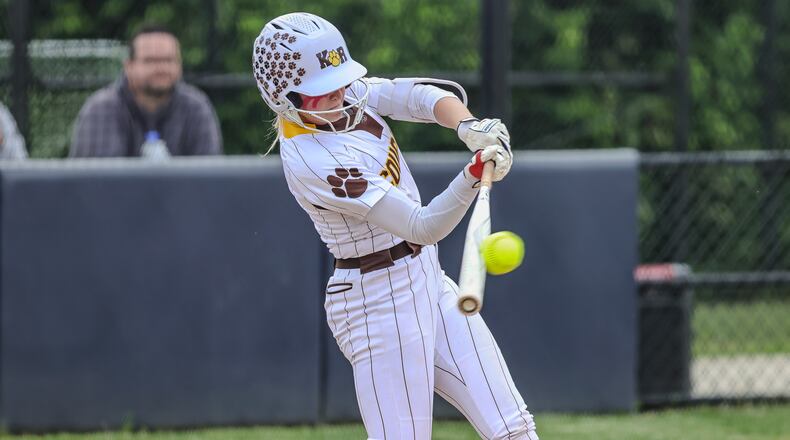 Kenton Ridge High School sophomore Jayden Davis hits the ball during their Division IV district final game against CHCA on Friday, May 23 at Valley View High School. The Cougars won 11-0. MICHAEL COOPER / STAFF