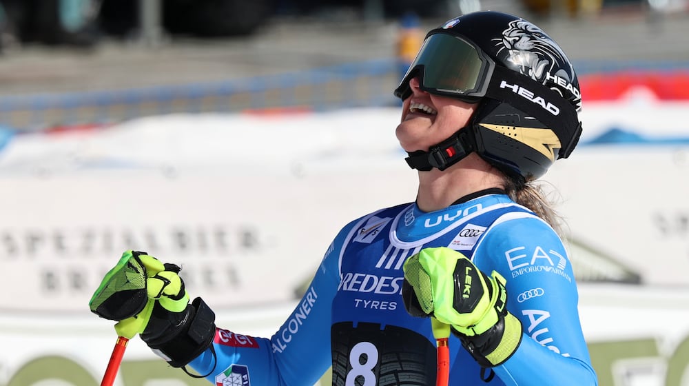 Italy's Laura Pirovano celebrates at the finish area of an alpine ski, women's World Cup downhill, in Val di Fassa, Italy, Friday, February. 27, 2026. (AP Photo/Marco Trovati)