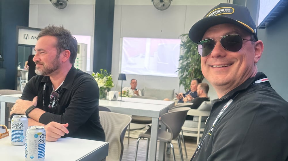 Former Joe Gibbs Racing competition director Chris Gabehart, right, and Spire co-owner Jeff Dickerson are pictured Saturday Feb. 28, 2026, at the IndyCar race in St. Petersburg, Fla. (AP Photo/Jenna Fryer)