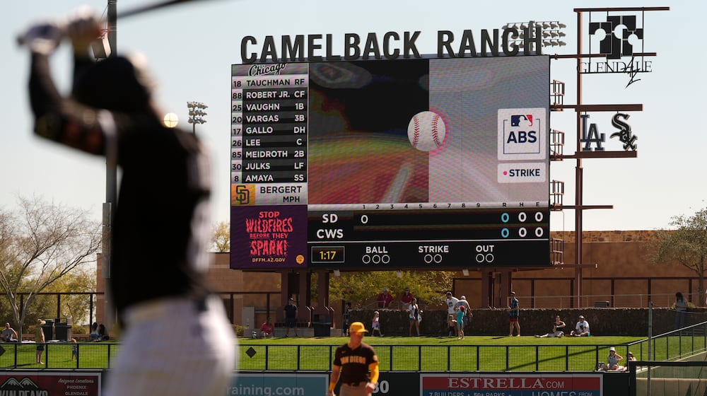 FILE - The Automated Ball/Strike System plays on the scoreboard after a pitch call was challenged during the first inning of a spring training baseball game between the Chicago White Sox and the San Diego Padres, Feb. 26, 2025, in Phoenix. (AP Photo/Carolyn Kaster, File)