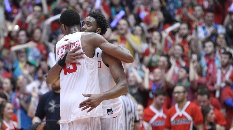 Dayton's Kostas Antetokounmpo and Josh Cunningham hug after a victory against Saint Louis on Tuesday, Feb. 20, 2018, at UD Arena.