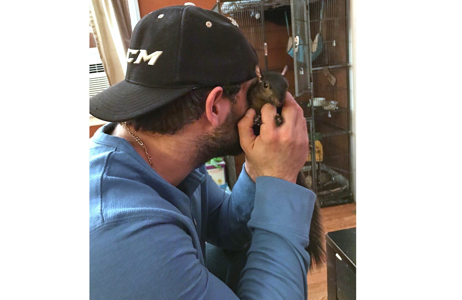 This December 2017 photo shows Mark Longo with Peanut, a squirrel who lived as a pet Longo in Southport, N.Y. (Mark Longo via AP))