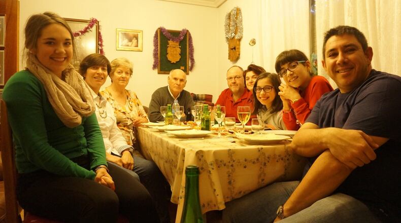 Rachel Leake (left) in Spain with some of her host mom’s extended family, ready for Christmas dinner last year. CONTRIBUTED