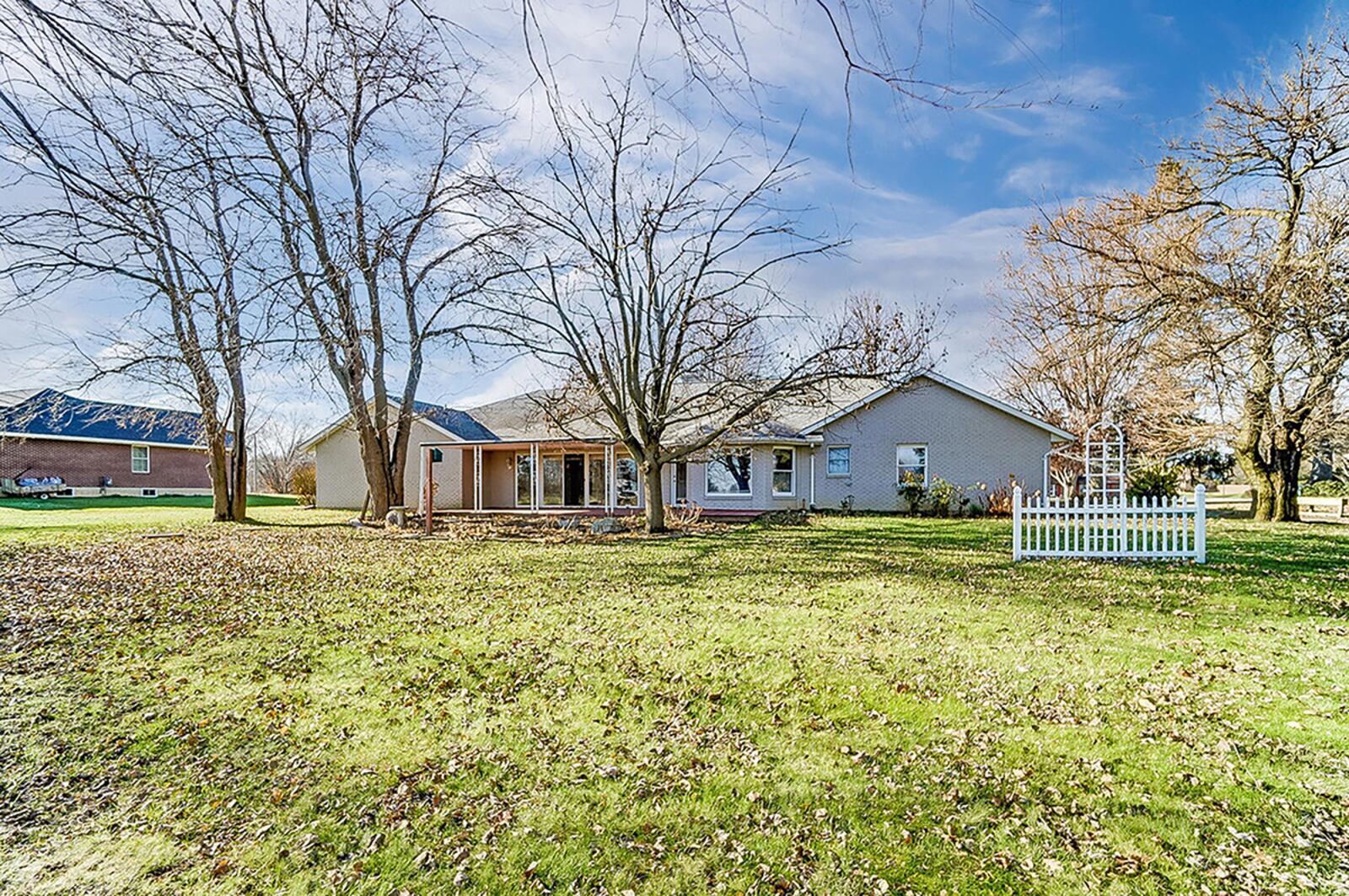 The rear of the home features a wood deck, recently refinished and partially covered. The large back yard features many mature trees and an open view due to no rear neighbors. CONTRIBUTED PHOTO