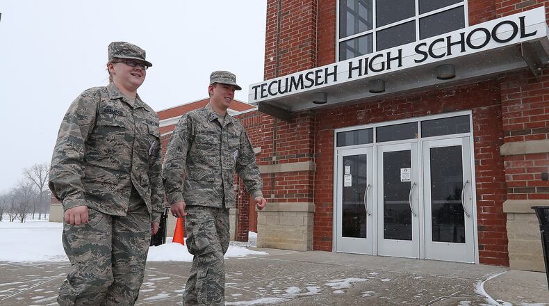 Tecumseh ROTC Cadet TSgt Harley Adamson and Cadet Major Matthew Lindamood walk past one of the entrances to Tecumseh High School Friday. Tecumseh ROTC is hosting an event next week honoring veterans of the Batan Death March and would like the community to come. Bill Lackey/Staff