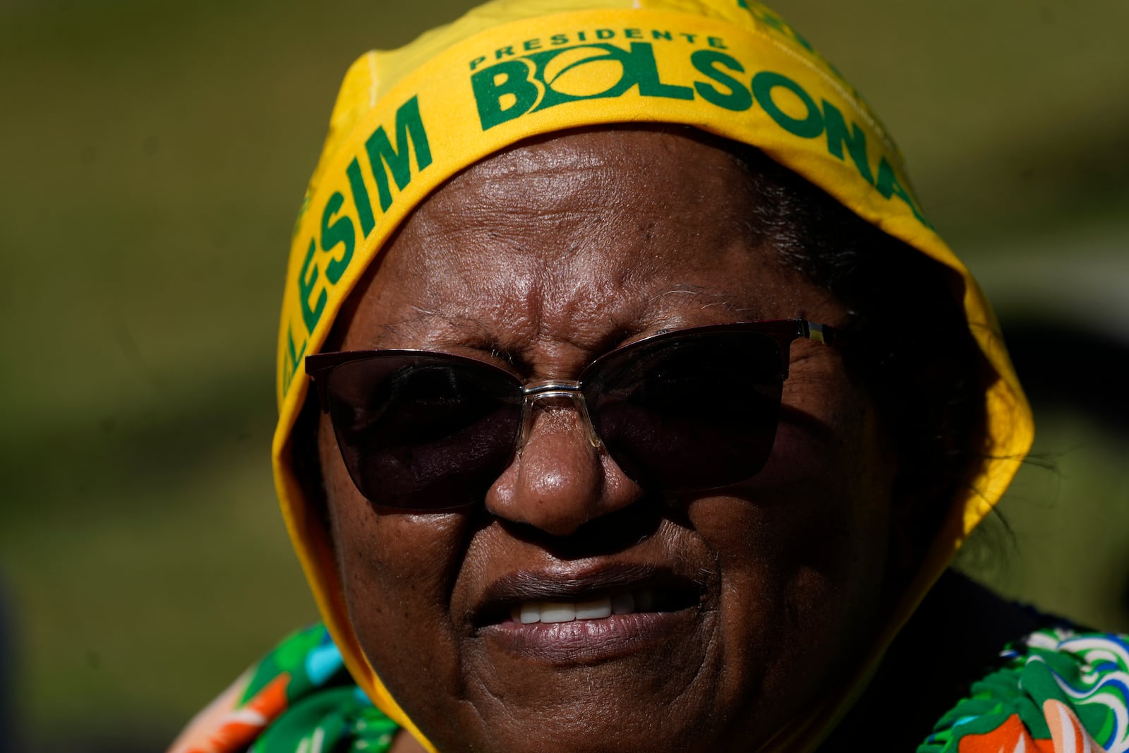 A supporter of former President Jair Bolsonaro waits for him to leave the hospital ahead of his expected departure after a weeks-long surgical stay, in Brasilia, Brazil, Sunday, May 4, 2025. (AP Photo/Eraldo Peres)