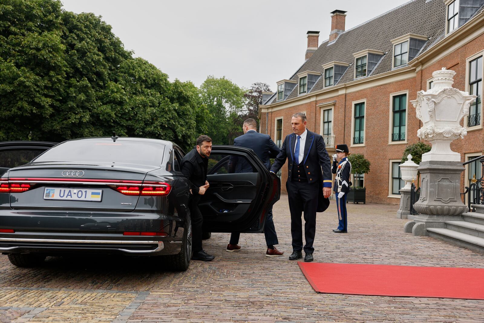 Ukraine's President Volodymyr Zelenskyy, left, arrives at the Paleis Huis ten Bosch ahead of a dinner on the sidelines of the NATO summit in The Hague, Netherlands, Tuesday, June 24, 2025. (Remko de Waal, Pool Photo via AP)