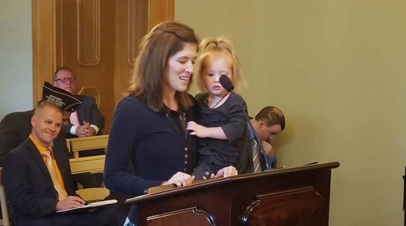Brianna McKinnon of Dayton testifies before members of the Ohio House about a bill she worked on with Rep. Rick Perales, R-Beavercreek. The bill will grant temporary professional licenses to members of the military and their spouses.