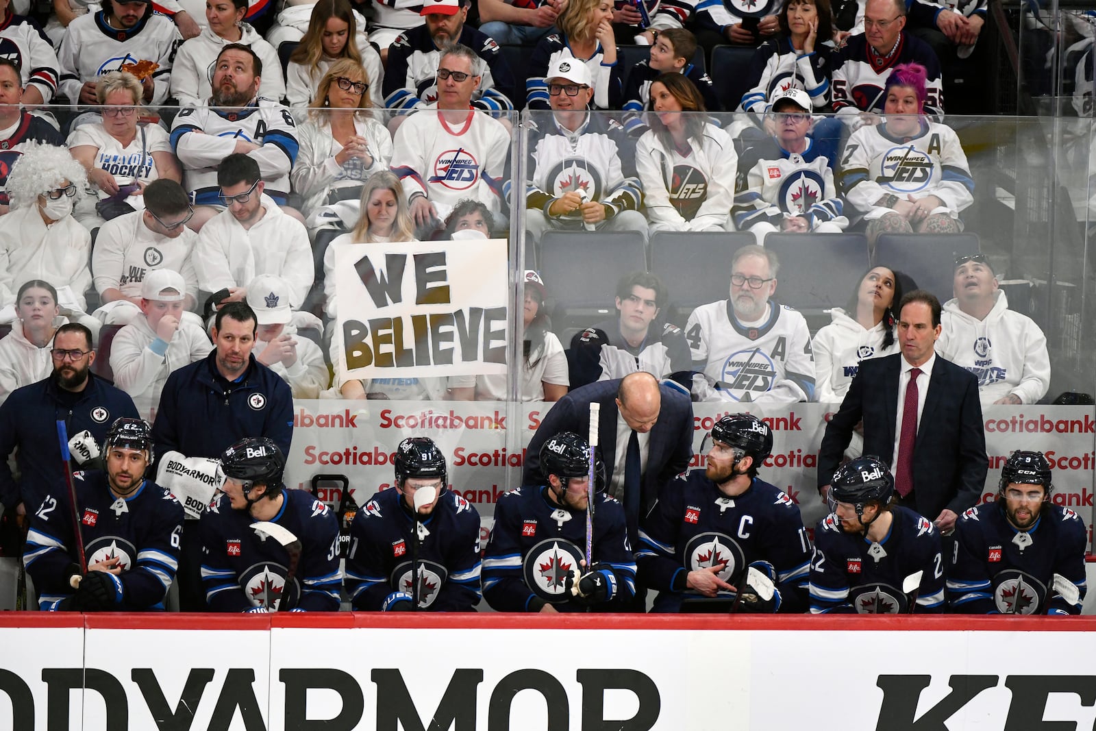 Winnipeg Jets players confer with coaches during a break in play against the St. Louis Blues during the first period of Game 7 in an NHL hockey first-round playoff series in Winnipeg, Manitoba, Sunday, May 4, 2025. (Fred Greenslade/The Canadian Press via AP)