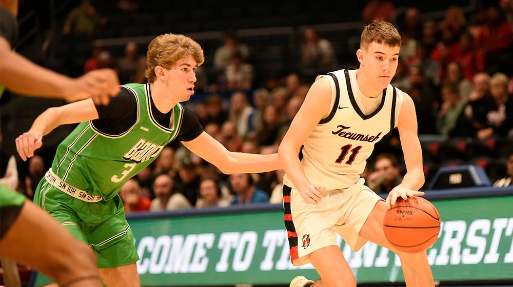 Tecumseh High School senior Corey Russell is guarded by Badin senior Cody Knapp during their Division III district final game on Saturday, March 7, 2026 at the University of Dayton Arena. GEOFF NEVILLE / CONTRIBUTED PHOTO