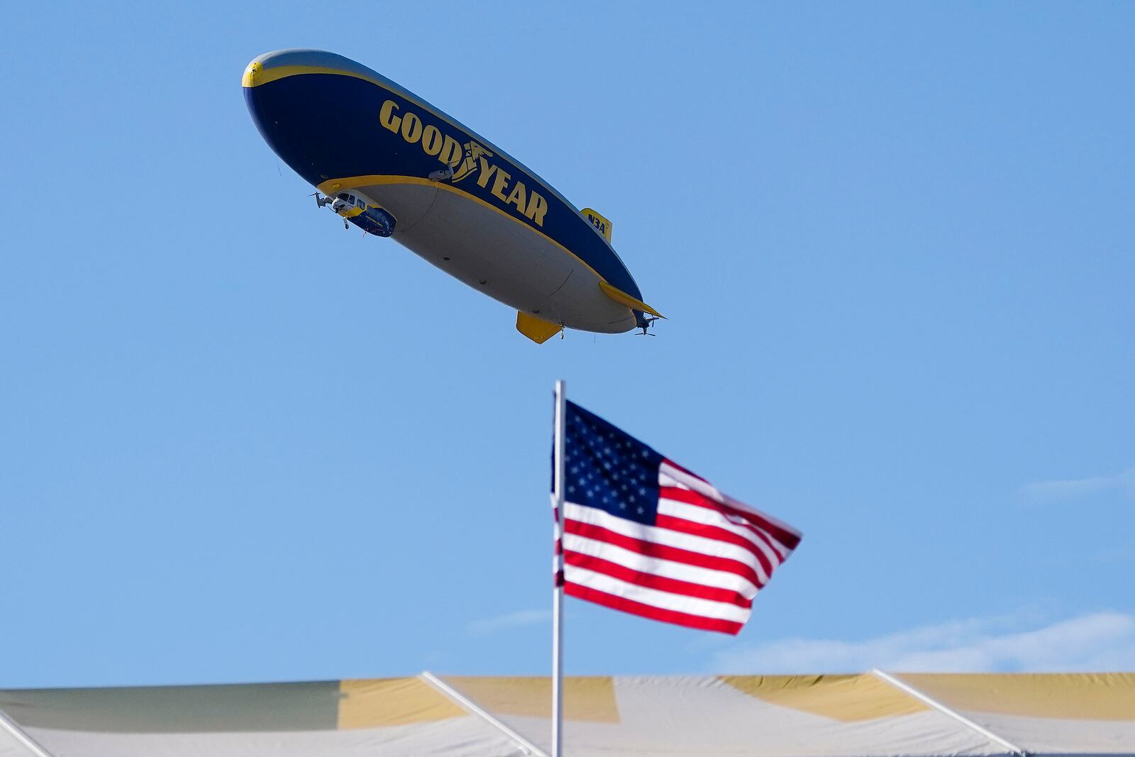 FILE - The Goodyear blimp hovers above the 16th hole during the Phoenix Open golf tournament, Sunday, Feb. 12, 2023, in Scottsdale, Ariz. (AP Photo/Darryl Webb, File)