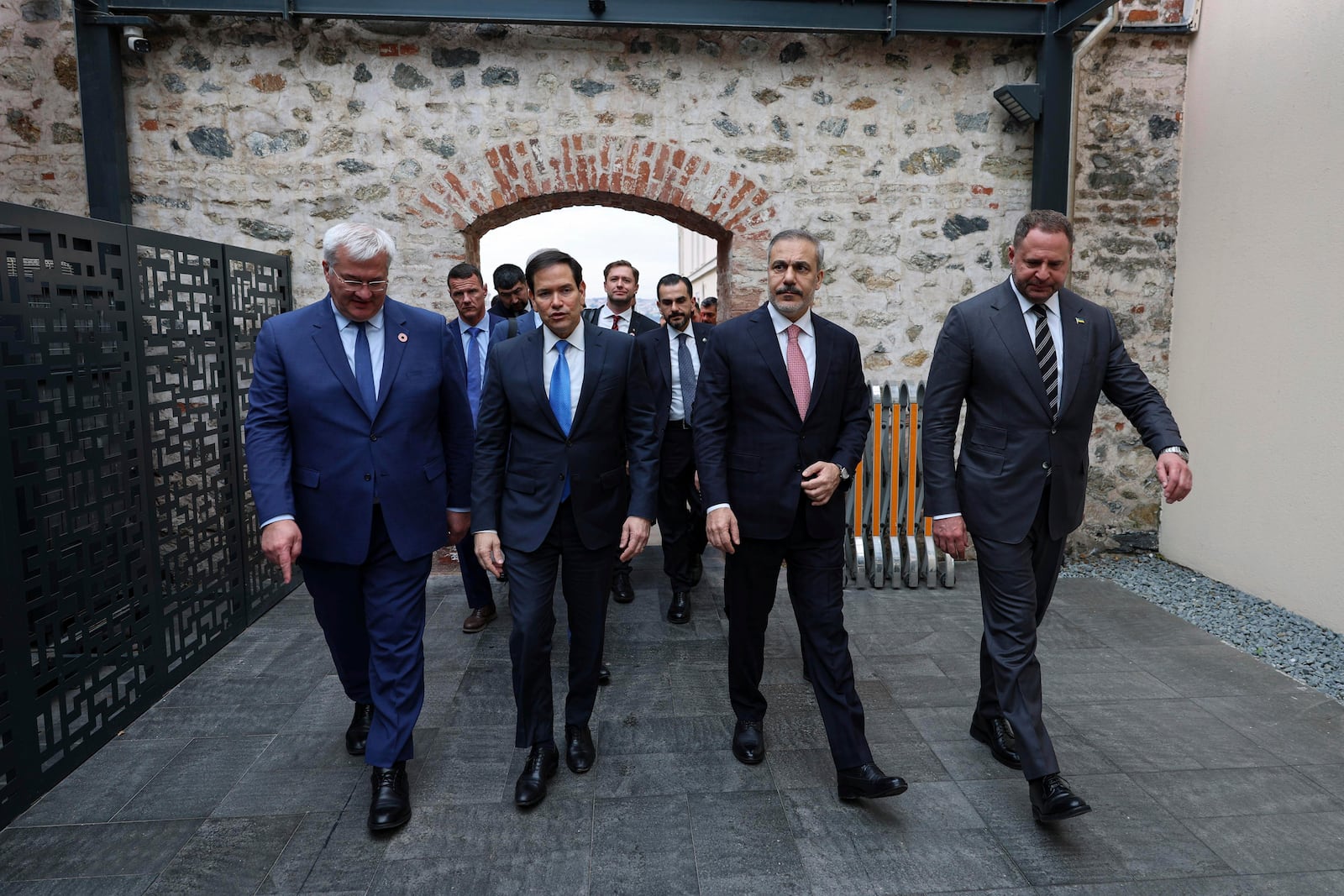 In this handout photo released by Turkish Foreign Ministry, from left, Ukraine's Foreign Minister Andrii Sybiha, U.S. Secretary of State Marco Rubio, Turkish Foreign Minister Hakan Fidan and Ukrainian Head of Presidential Office Andriy Yermak arrive for a meeting at Dolmabahce palace in Istanbul, Turkey, Friday, May 16, 2025. (Turkish Foreign Ministry via AP)