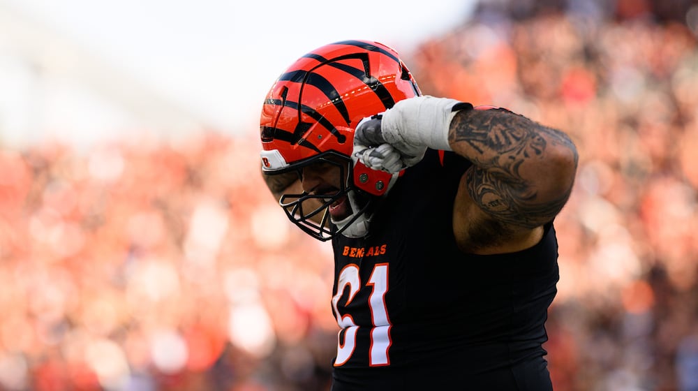 Cincinnati Bengals offensive lineman Cody Ford celebrates after a catch and run during their 37-14 victory over the Arizona Cardinals on Sunday, Dec. 28, at Paycor Stadium. JEREMY MILLER / CONTRIBUTED PHOTO