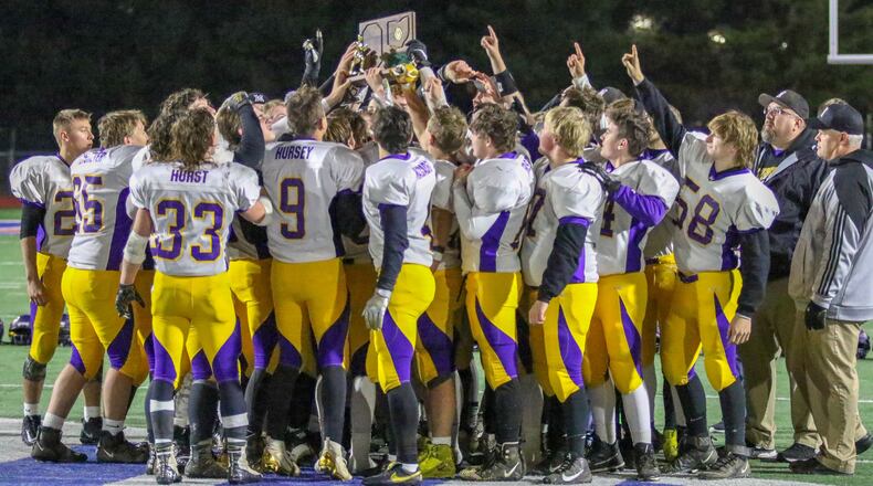 The Mechanicsburg High School football team raises the D-VI Region 24 championship trophy after beating Covington 42-26 on Friday night at Piqua’s Alexander Stadium. The Indians advanced to the D-VI state semifinals for the first time since 2013. CONTRIBUTED BY MICHAEL COOPER