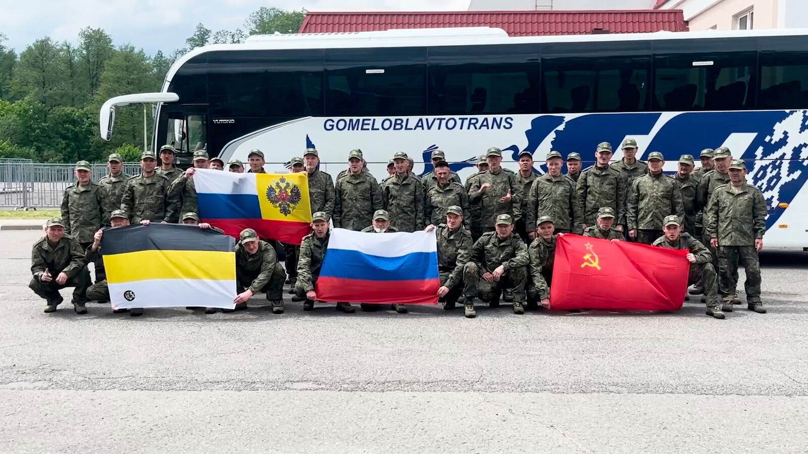 In this photo taken from a video released by Russian Defense Ministry press service, Russian servicemen pose after returning from captivity after an exchange between Russia and Ukraine, at an undisclosed location in Belarus, Saturday, May 24, 2025. (Russian Defense Ministry Press Service via AP)