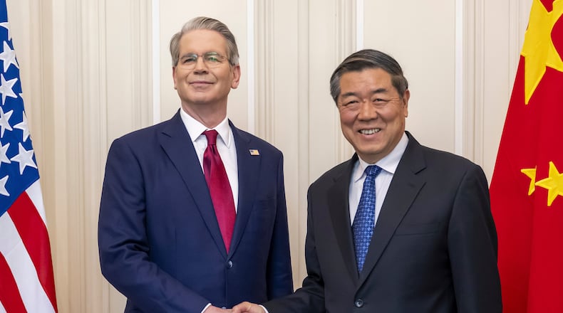 FILE - U.S. Secretary of the Treasury Scott Bessent, left, shakes hands with Chinese Vice Premier He Lifeng, right, during a bilateral meeting between the United States and China, in Geneva, Switzerland, on Saturday, May 10, 2025. (Martial Trezzini/Keystone via AP, File)