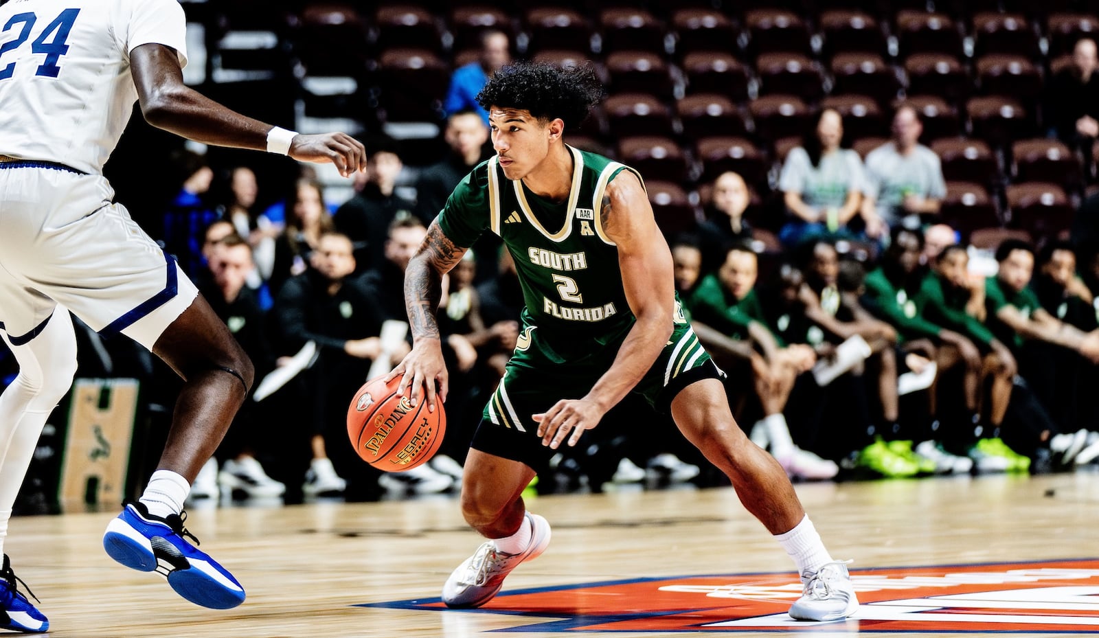 South Florida's Wes Enis, a Miami East graduate, dribbles against George Washington on Nov. 3, 2025, at the Yuengling Center in Tampa, Fla. Photo courtesy of South Florida