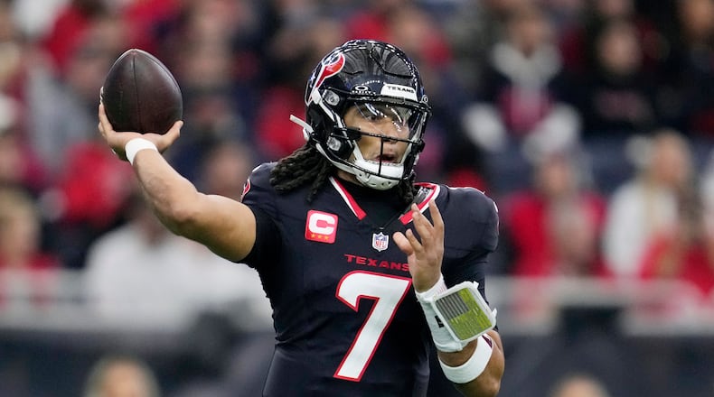 Houston Texans quarterback C.J. Stroud throws against the Arizona Cardinals during the first half of an NFL football game Sunday, Dec. 14, 2025, in Houston. (AP Photo/Ashley Landis)