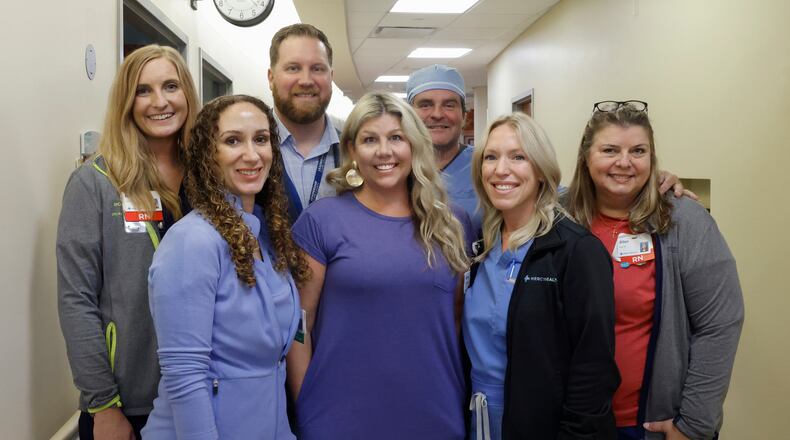 Front left to right: Michelle Caeser, APRN-CNP Interventional Neurology, patient Danielle Gillam, Erin Jordan APRN-CNP-Interventional Neurology, Ellen Hardin, RN Stroke Coordinator. Back left to right, Molly Karch, RN Stroke Coordinator, Chase Collins, RN Director of Neurosciences, and Dr. Jody Short, DO Vascular and Interventional Neurologist, on Wednesday, May 7, 2025, at Mercy Health Springfield. The doctors were on Gillam's care team when she was recovering from a stroke she had in September 2024. JOSEPH COOKE/STAFF