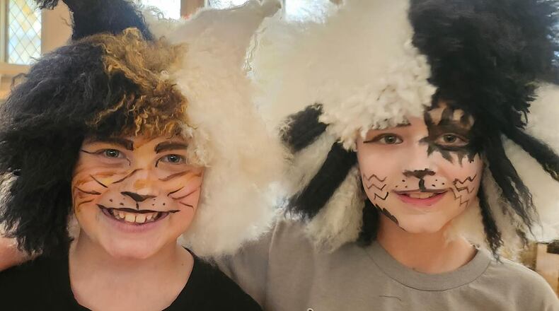 Volunteers have spent weeks knitting the headgear that will kids into "Cats" for the Ohio Performing Arts Institute's upcoming junior theater production of the classical musical this weekend.