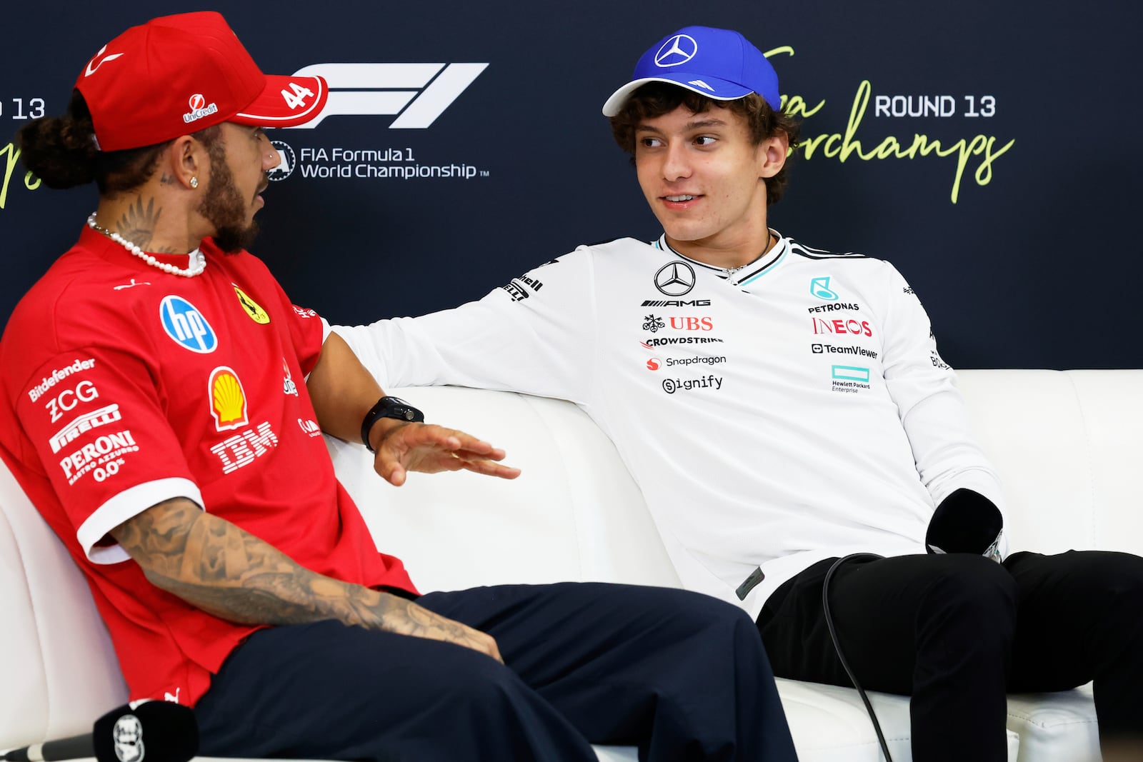 Mercedes driver Kimi Antonelli of Italy, right, and Ferrari driver Lewis Hamilton of Britain attend a media conference ahead of the Formula One Grand Prix at the Spa-Francorchamps racetrack in Spa, Belgium, Thursday, July 24, 2025. (AP Photo/Geert Vanden Wijngaert)