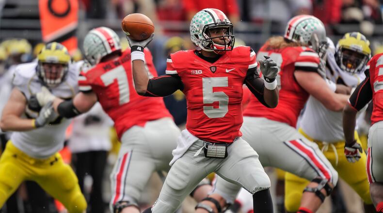 COLUMBUS, OH - NOVEMBER 24: Quarterback Braxton Miller #5 of the Ohio State Buckeyes controls the ball against the Michigan Wolverines at Ohio Stadium on November 24, 2012 in Columbus, Ohio. (Photo by Jamie Sabau/Getty Images)
