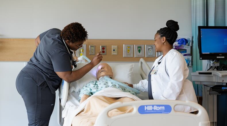(L to R) Sinclair Community College Nursing students Areun Foster and Danielle Johnson in the Health Sciences Simulation Center. COURTESY OF SINCLAIR