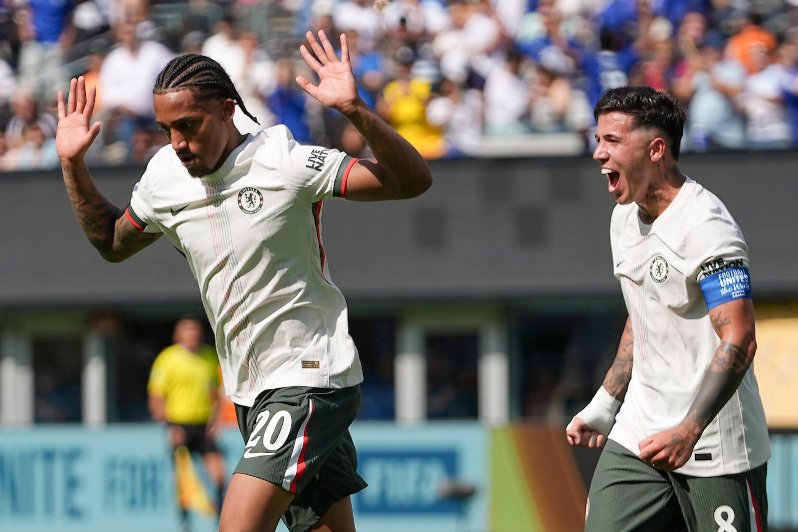Chelsea's Joao Pedro, left, and Chelsea's Enzo Fernandez celebrate after Pedro scored a goal against Fluminense during the second half of a Club World Cup semifinal soccer match in East Rutherford, N.J., Tuesday, July 8, 2025. (AP Photo/Frank Franklin II)
