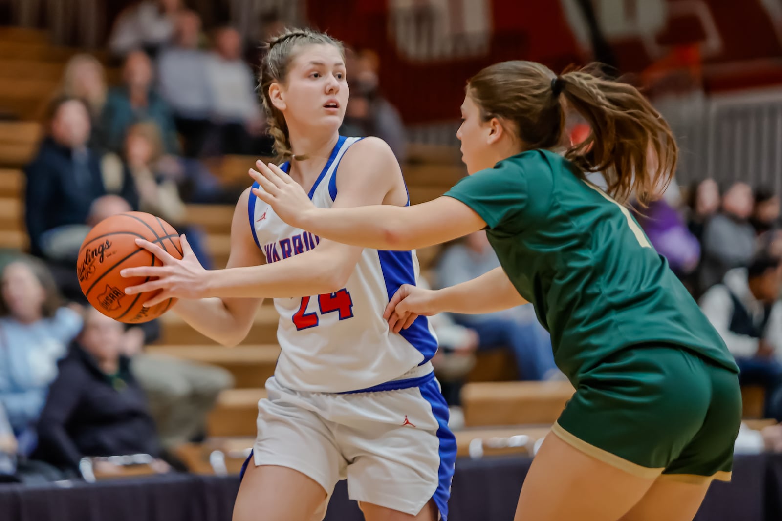 Northwestern High School sophomore Lily Bushey is guarded by Catholic Central senior Alyssa Gram  during their game on Tuesday, Dec. 30 at Wittenberg University's Pam Evans Smith Arena in Springfield. MICHAEL COOPER / STAFF