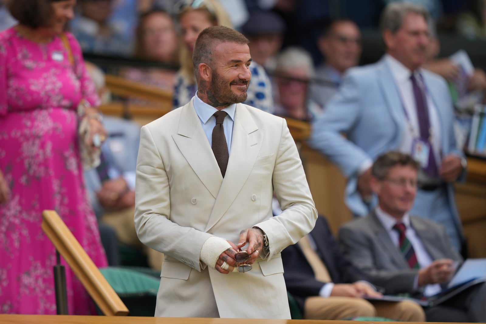 Sir David Beckham arrives to take his seats in the Royal Box on Centre Court on day one at the Wimbledon Tennis Championships in London, Monday, June 30, 2025. (AP Photo/Alastair Grant)