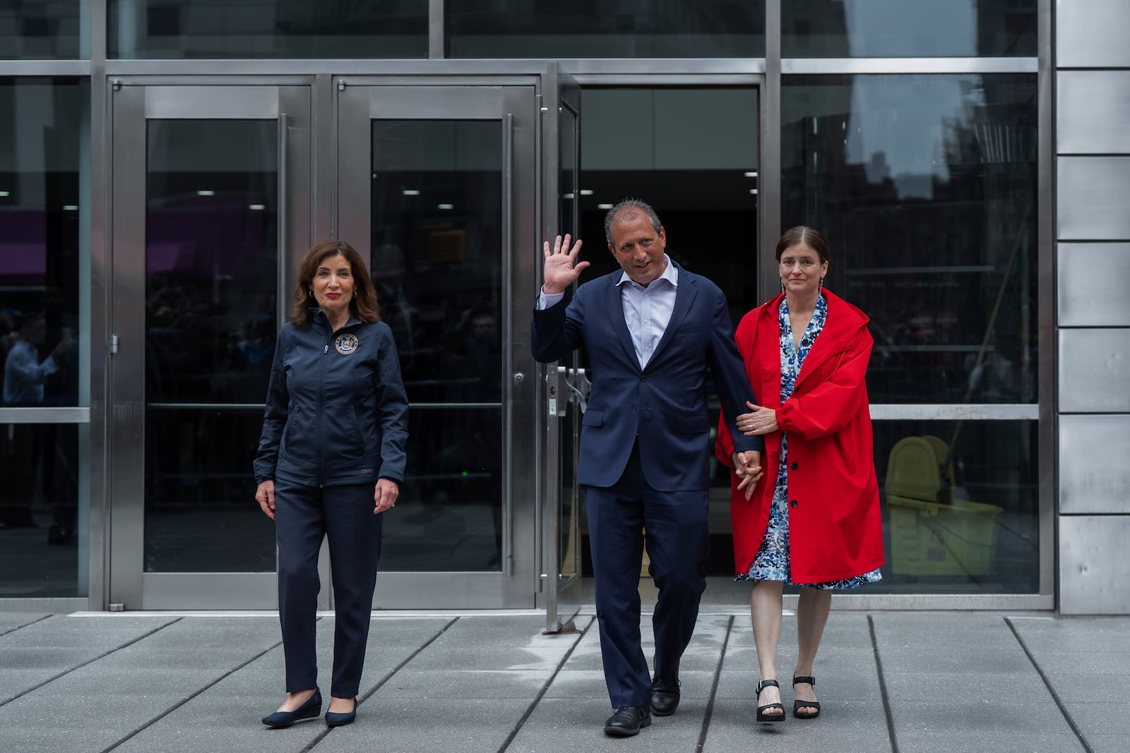 New York City Comptroller Brad Lander, center, leaves Jacob K. Javits Federal Building with wife, Meg Barnette, right, and New York Gov. Kathy Hochul, left, after being released from arrest outside federal immigration court on Tuesday, June 17, 2025, in New York. (AP Photo/Olga Fedorova)