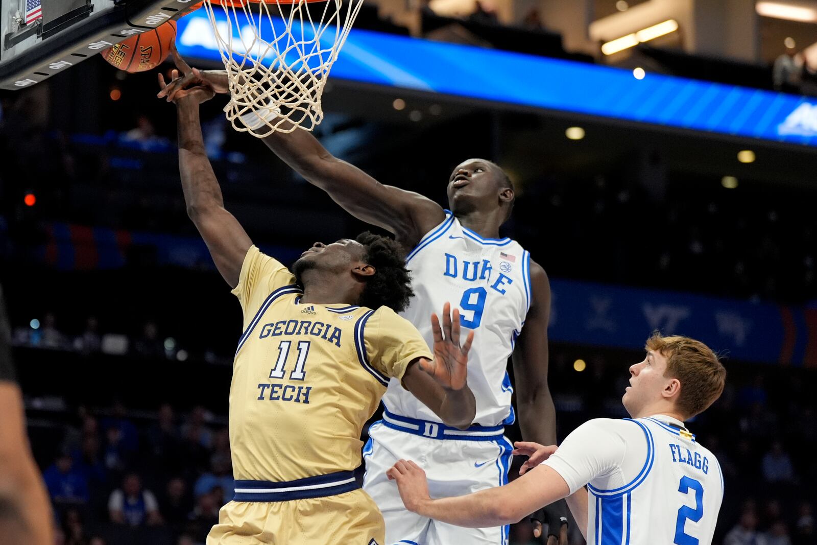 Duke center Khaman Maluach blocks a shot by Georgia Tech forward Baye Ndongo during the first half of an college basketball game in the quarterfinals of the Atlantic Coast Conference tournament, Thursday, March 13, 2025, in Charlotte, N.C. (AP Photo/Chris Carlson)