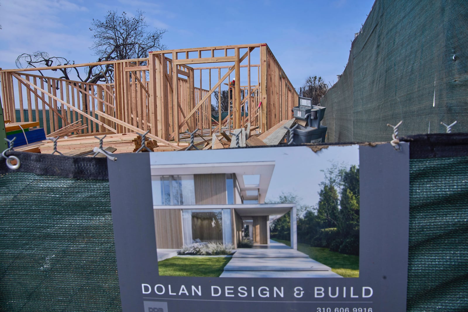 A home is rebuilt in the Palisades Fire damage zone in the Pacific Palisades neighborhood of Los Angeles, Thursday, April 24, 2025. (AP Photo/Damian Dovarganes)