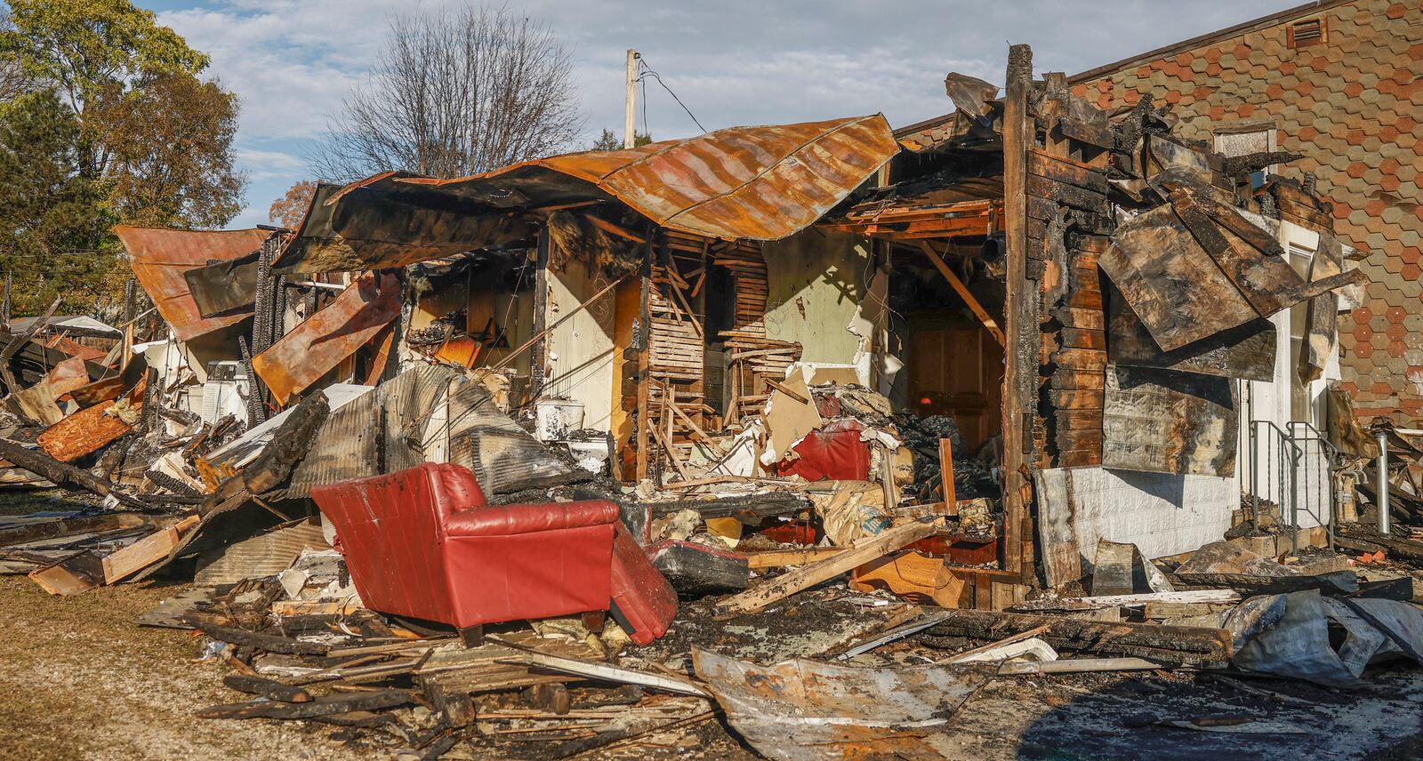 A building is severely damaged on Monday, November 4, 2025, after a fire on the 300 block of West Court Street in Urbana. JOSEPH COOKE/STAFF