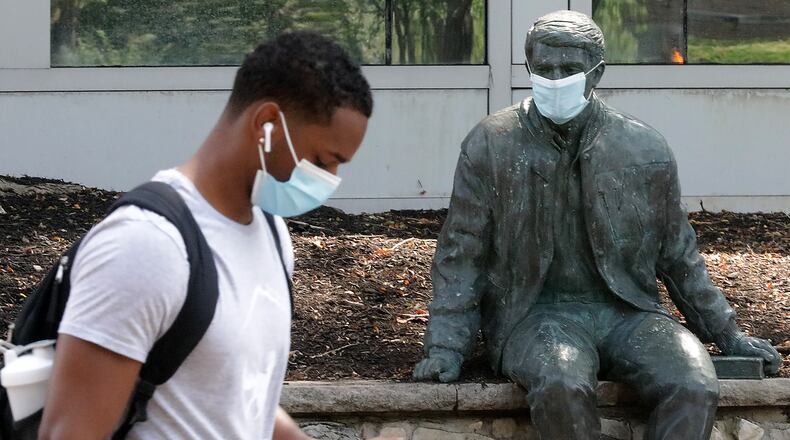 Everyone at Wittenberg University was wearing masks Tuesday from Wittenberg senior Kris Thompson to Wally Witt, the statue outside of the Benham-Pence Student Center. BILL LACKEY/STAFF