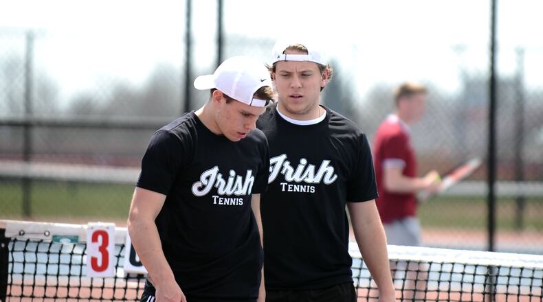 Catholic Central’s doubles tennis team of Jack Brougher (left) and Colin Kelly (right), both seniors, compete in the Division II district tournament Thursday at the Lindner Family Tennis Center in Mason. Greg Billing / Contributed