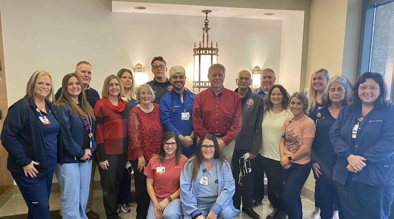 Greg Brumfield is pictured here with Mercy Health Springfield Regional Medical Center employees who saw him through his emergency surgery and recovery. Photo provided by Mercy Health.