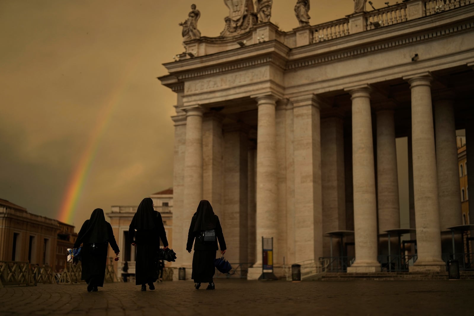 FILE - Nuns walk along St. Peter's Square during the fourth day of mourning for late Pope Francis at the Vatican, Tuesday, April 29, 2025. (AP Photo/Francisco Seco, File)