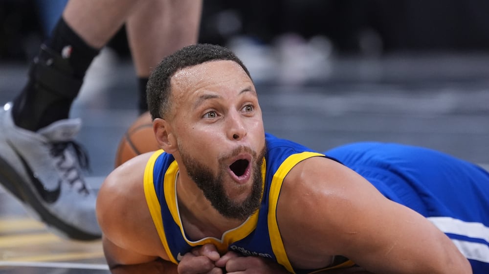 Golden State Warriors guard Stephen Curry (30) reacts after he was fouled during the second half of an NBA Cup basketball game against the San Antonio Spurs in San Antonio, Friday, Nov. 14, 2025. (AP Photo/Eric Gay)